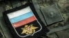 UKRAINE – Chevrons and patches of the Russian military after the battles in the Kyiv region, from where they were knocked out by the Armed Forces of Ukraine. The village of Moschun in the Buchan district of the Kyiv region. April 8, 2022 